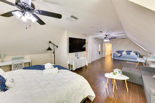 a bedroom with a large bed and a living room at 4 Mi to Dtwn Riverside Gem with Pool and Game Room in Riverside