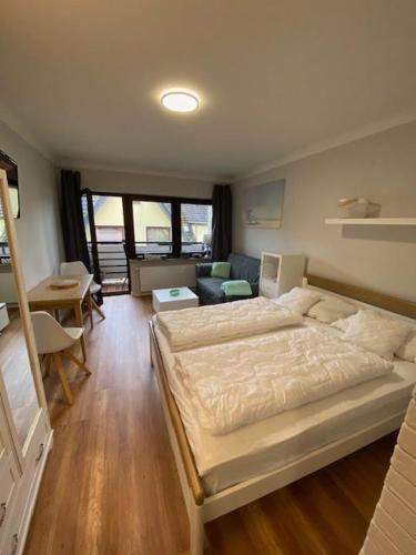 Postel nebo postele na pokoji v ubytování Haus Schwanensee Wohnung 24