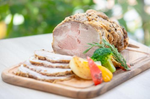 a plate of food with meat and vegetables on a table at Rembrandt Style Naha in Naha