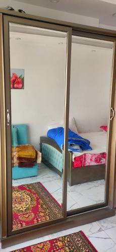 a room with two bunk beds and a mirror at شالية غرفتين Porto Said in Port Said