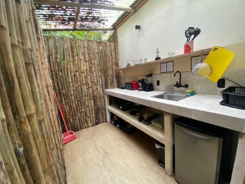a kitchen with a sink and a counter top at Mini Jungle Villa in Manzanillo