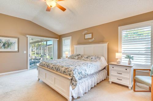 a bedroom with a bed and a window at 2 Mi to Lake Sumter Landing Spacious Golf Retreat in The Villages