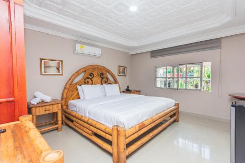 Postel nebo postele na pokoji v ubytování Hotel Baluarte Cartagena Boutique