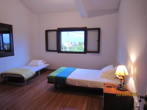 Ένα ή περισσότερα κρεβάτια σε δωμάτιο στο Dimitris Villa