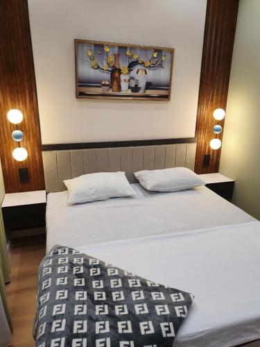 En eller flere senge i et værelse på Комфорт и Уют