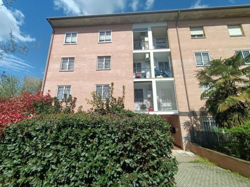 an apartment building with a hedge in front of it at Casa Terzi in Bologna