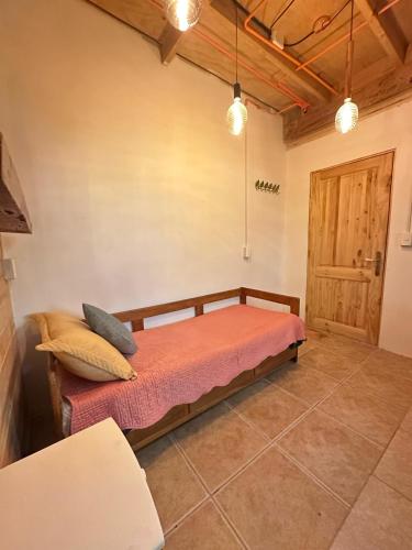 a bedroom with a bed in a room with a door at Doña Patty in El Tabo