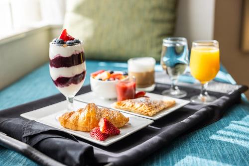 a tray with desserts and drinks on a table at Delta Hotels by Marriott Prince Edward in Charlottetown