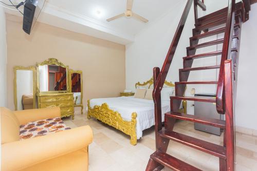a living room with a staircase leading to a bedroom at Hotel Baluarte Cartagena Boutique in Cartagena de Indias