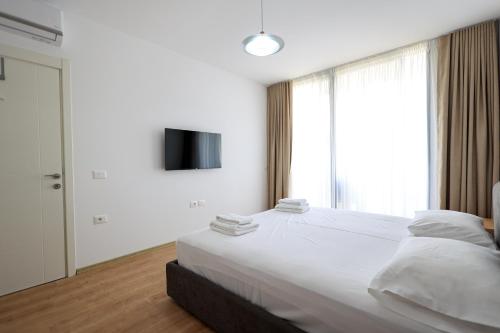 Un ou plusieurs lits dans un hébergement de l'établissement SanPietro Vacation Rentals