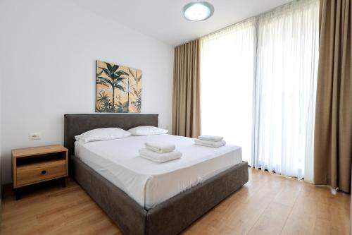 Un ou plusieurs lits dans un hébergement de l'établissement SanPietro Vacation Rentals