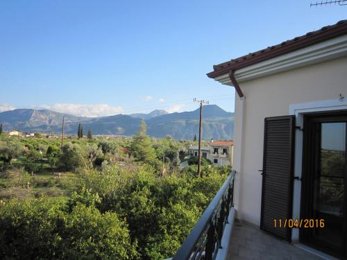 a balcony with a view of the mountains at Dimitris Villa in Aígio