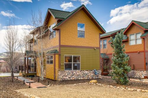a house with a yellow at Riverfront Cabin 4 Mi to Granby Ranch in Granby