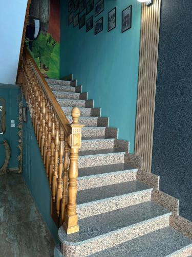 a set of stairs in a house with a stair case at Hostal imperio in Tomelloso