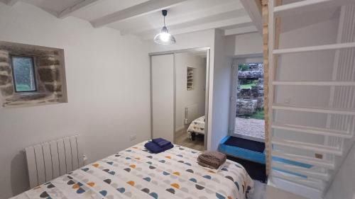 Ένα ή περισσότερα κρεβάτια σε δωμάτιο στο Maison route des plages