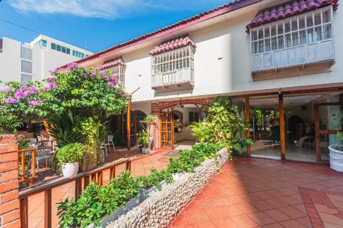an exterior view of a building with plants at Hotel Baluarte Cartagena Boutique in Cartagena de Indias