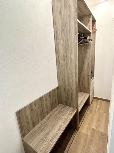 a room with a wooden shelf in a room at Bio B&B La Scoperta del Pollino in Laino Castello