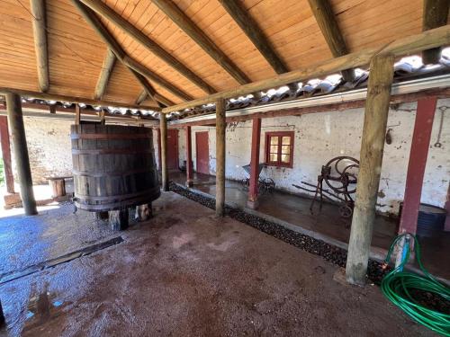 an empty room with a barrel in a building at Casa Bagual in Calivoro