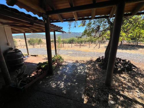a porch of a house with a view of a field at Casa Bagual in Calivoro