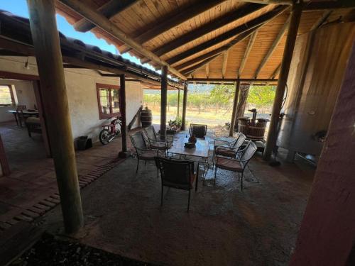 a patio with a table and chairs in a building at Casa Bagual in Calivoro