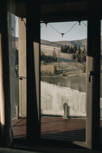 a view from a window looking out at a field at Laska House in Pylypets