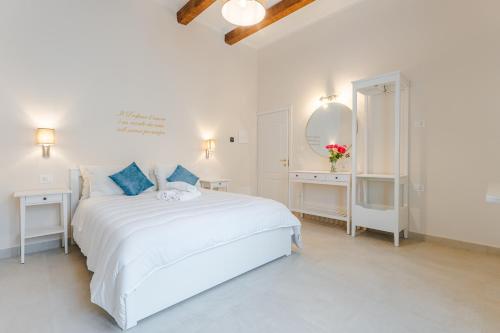 Postel nebo postele na pokoji v ubytování Relais Villa Rizzi