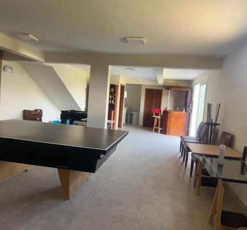 a living room with a pool table in it at Casa em condomínio rural in Rancho Queimado