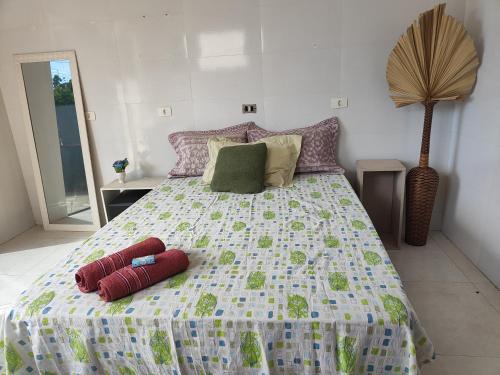 a bedroom with a bed with two pillows on it at Premium Apartment Double Bedroom in Cianorte