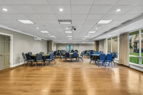 a large room with chairs and tables in it at Eastlake Suites Hotel & Conference Center By OYO Urbana in Champaign