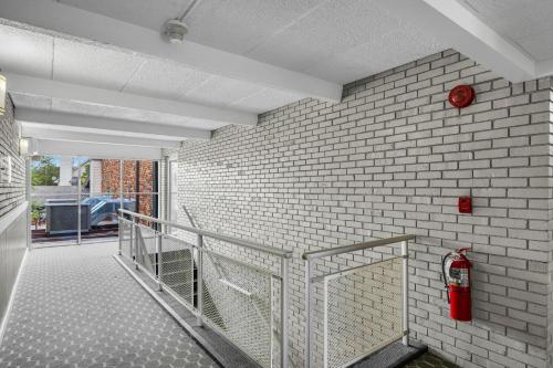 a white brick wall with a fire hydrant on it at Eastlake Suites Hotel & Conference Center By OYO Urbana in Champaign