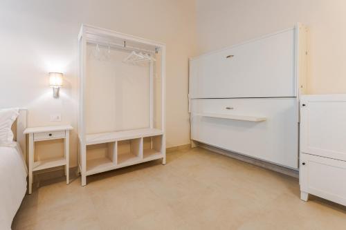 Postel nebo postele na pokoji v ubytování Relais Villa Rizzi