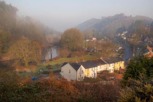a small town with houses and a mountain at Walker's Rest in Newland
