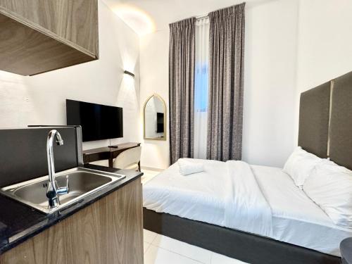 a hotel room with a bed and a sink at Al Manara Classic Cozy Studio in Dubai