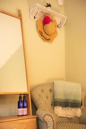 a room with a mirror and a stuffed animal on the wall at Walker's Rest in Newland