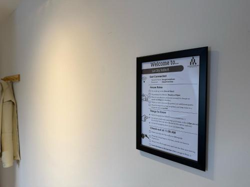 a picture of a menu on a wall at The Cozy Nest Stylish and Serene City Studio in Eindhoven