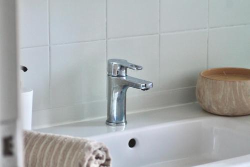 a sink with a faucet on top of it at Apto el Piset, acogedor y céntrico del Montseny in Arbúcies