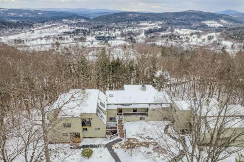 an aerial view of a house in the snow at Steps to Ski Trail Fireplace - Kingswood 1B in Quechee