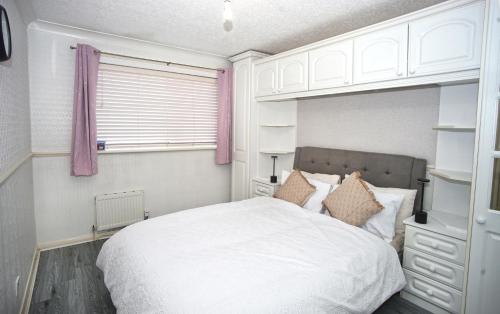 Una cama o camas en una habitación de The Leigh Nest