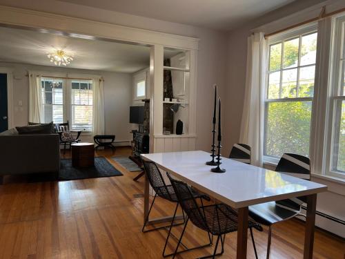 a living room with a table and chairs and a living room at Phoenicia Bungalow in Phoenicia