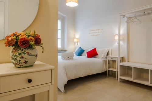 Postel nebo postele na pokoji v ubytování Relais Villa Rizzi