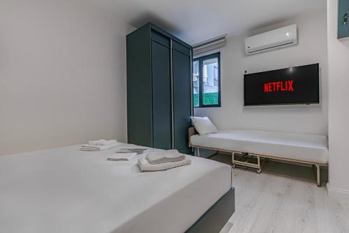 Ένα ή περισσότερα κρεβάτια σε δωμάτιο στο Tulii Rooms