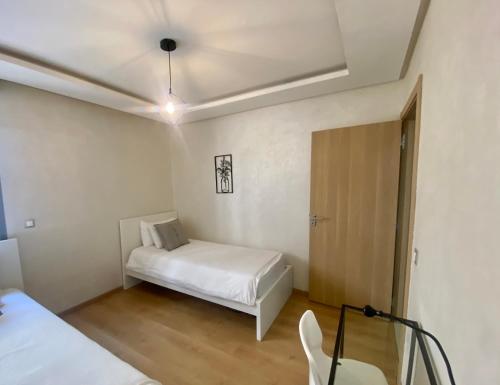 Ένα ή περισσότερα κρεβάτια σε δωμάτιο στο Appartement près de Novotel face au parc WELCOME STAY