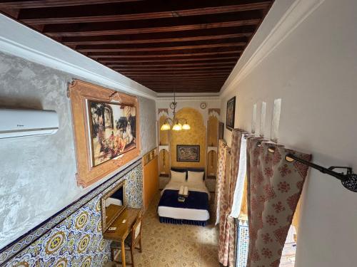 a bedroom with a bed in a room at RIAD ESMERALDA By Dar Ouezzani in Rabat