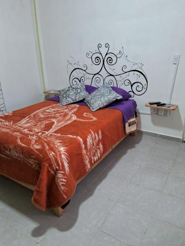 Una cama o camas en una habitación de Mixtlaxotla Zacatlán Tours