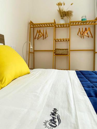 a bed with a white bedspread with at Vistamare Oltremare in San Cataldo
