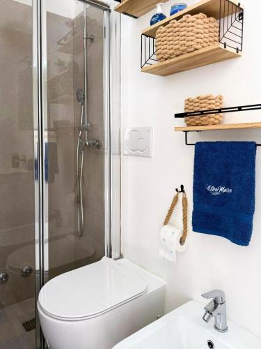 a bathroom with a shower and a toilet and a sink at Vistamare Oltremare in San Cataldo