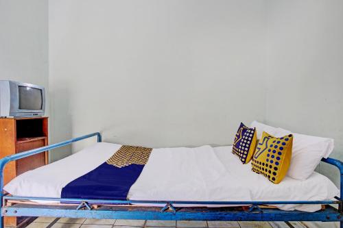 Postel nebo postele na pokoji v ubytování SPOT ON 92336 Hotel Sukowati