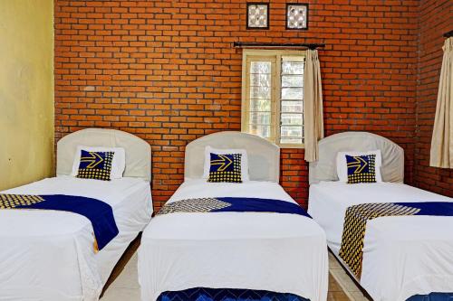 Ένα ή περισσότερα κρεβάτια σε δωμάτιο στο Hotel O Griyo Werdiningsih