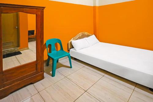 Ένα ή περισσότερα κρεβάτια σε δωμάτιο στο Hotel O Pondokan Tali Super