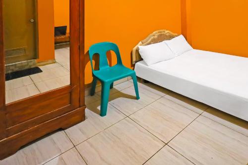 Ένα ή περισσότερα κρεβάτια σε δωμάτιο στο Hotel O Pondokan Tali Super